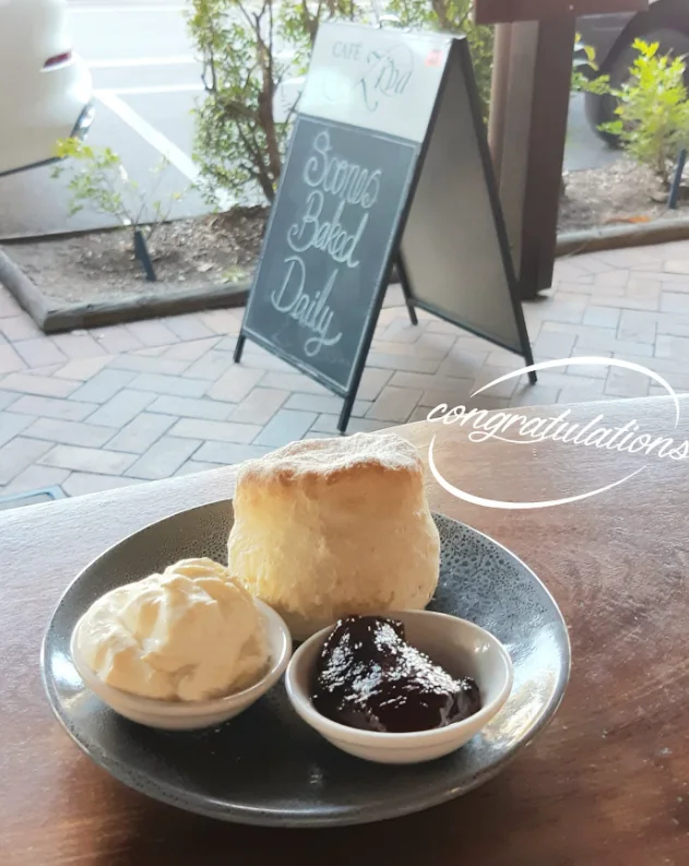 Fresh scone served with cream and jam